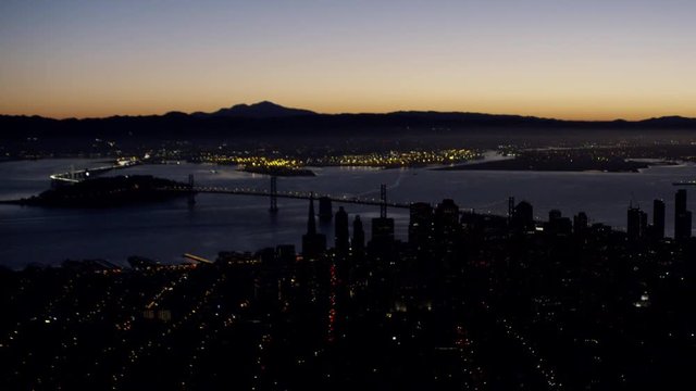 Aerial sunrise view Bay Bridge city Skyscrapers San Francisco USA