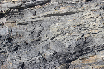 Ancient rock with integrated built brick wall