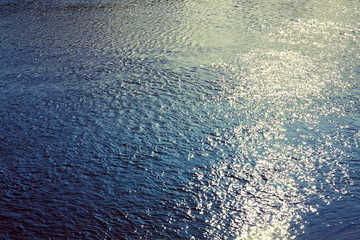 sun sparkles in the sea water