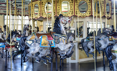 Fototapeta na wymiar Vintage carousel merry-go-round horses 