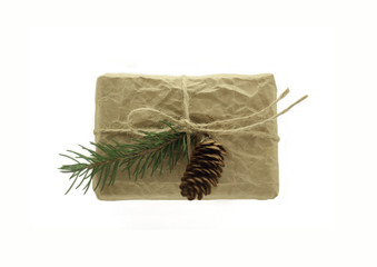 Gift box with spruce branch and cone.