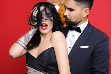 Bearded man looking at sensual woman near balloons