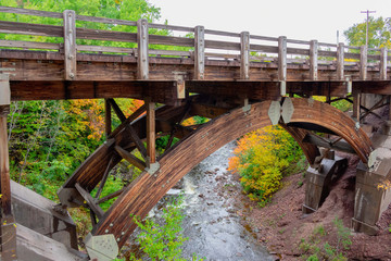Fototapeta na wymiar Timber bridge over river