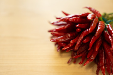 Fototapeta premium Dried red chili on a wood table