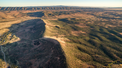 Aerial landscape view in the late afternoon of the Southern Escarpment of Wilpena Pound in the Flinders Ranges, South Australia.