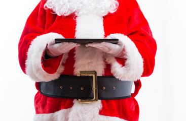 Santa holding a tablet computer isolated on white background