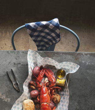 Lobster Dinner with corn, potatoes, boiled eggs and potatoes.