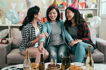 Group of young friends celebrating in home