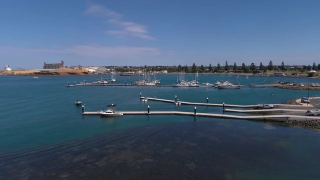 Drone aerial soaring up over Portland Marina during beautiful sunny day. Filmed under our CASA ReOC UAV commercial license with full permissions.