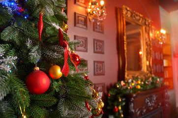 Christmas tree decorated with garlands, close-up.