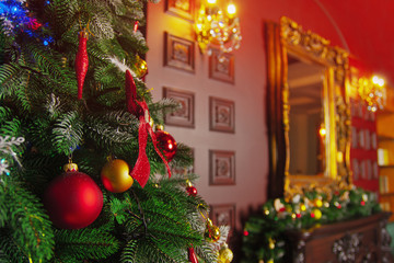 Christmas tree decorated with garlands, close-up.