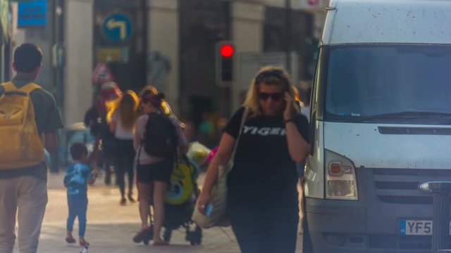Timelapse of passing people in the city center in Bournemouth, England.