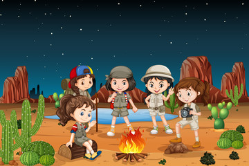Group of children camping in the desert