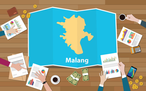 malang indonesia java city region economy growth with team discuss on fold maps view from top