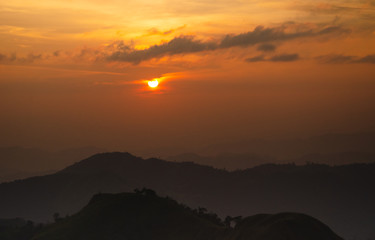 Beautiful landscape of Sunrise with mist, sky and cloud from top mountain in Sunrise at Thailand