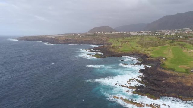 Aerial view of cliffs and Atlantic ocean on Tenerife, drone shot from above, Canarias islands, Spain