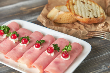 Ham roll ups stuffed with cheese, garlic and mayonnaise