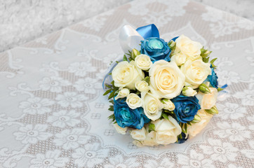 Wedding bouquet of yellow and blue roses