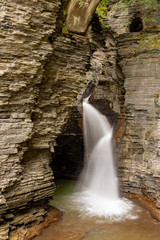 Fototapeta na wymiar Waterfall cascading over the rocks in state park