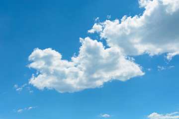 Naklejka na ściany i meble Two white clouds on the blue sky background