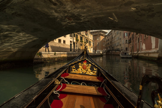 Inside Gondola View As It Going Under The Bridge On Canals In Venice