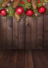 Christmas tree red ornaments on a wooden table. Christmas and new year background. Free space for text.