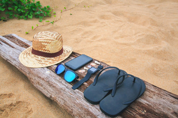 Summer holiday background, Beach accessories on the beach, Vacation and travel items,In tropical Phuket Thailand.