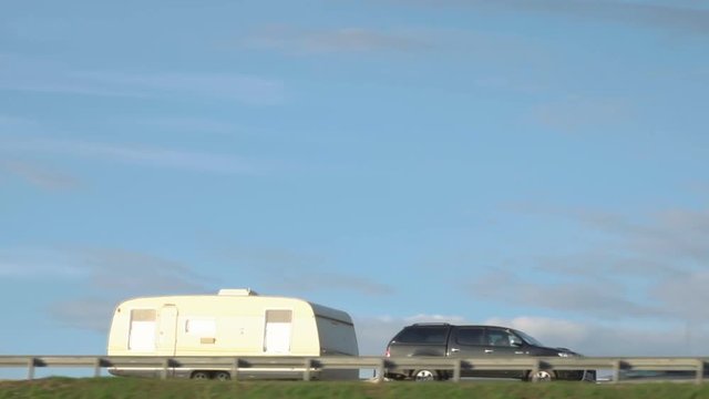 Caravan at a bridge in Europe. Family vacation travel, holiday trip in motorhome, Caravan car Vacation.