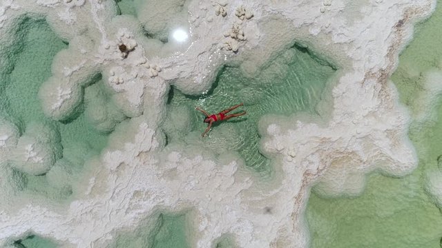 woman floating in the Dead Sea salt