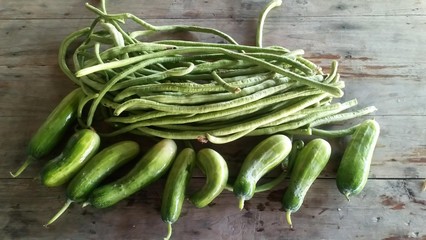 Vegetable..longan and cucumber ... put on a wooden table.