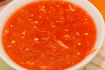 Tomato sauce with horseradish in a small plate.