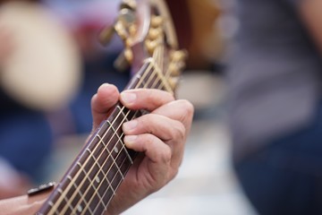 The guitar is stringed.