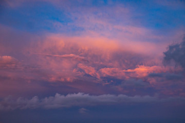 dramatic blue sky with orange clouds at sunset