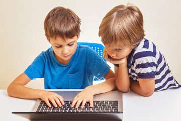 Two kids with laptop computer