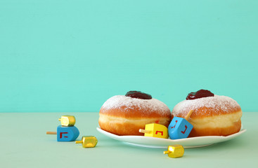 Banner of jewish holiday Hanukkah with wooden dreidels (spinning top).