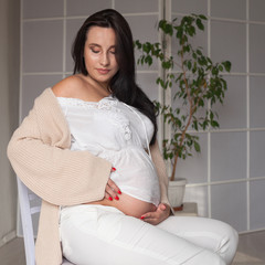 Portrait of beautiful pregnant woman before childbirth family