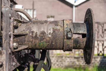 big metal buffer on a Train to absorb impacts between train and wagon - closeup