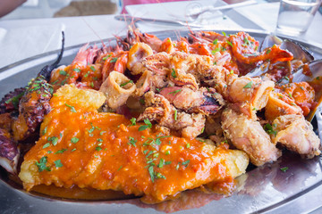 Seafood of Greece and Cyprus speciality on the plate with octopus, calamari, prawn and shrimp