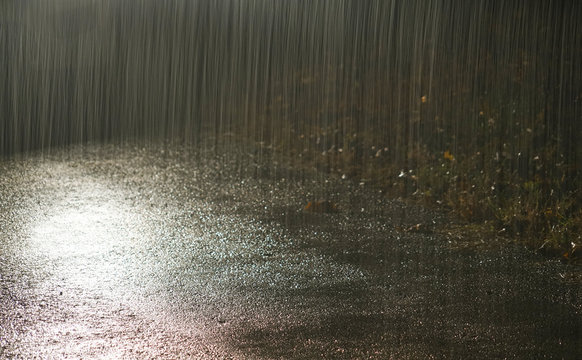 Heavy Rain Under Light At Night