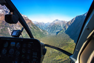 Scenic helicopter flight with view from cockpit,  Milford Sound , Fiordland National Park, South Island, New Zealand.