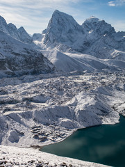 Beautiful snowy mountains with a turquoise lake. Gokyo and Cholatse