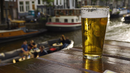Closeup of beer alongside Amsterdam canal.