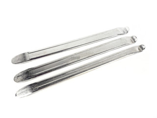 Motorcycle tyre lever chrome plated on white background.