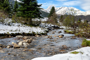 small river in the pyrenees mountains with Pic du Midi de Bigorre in background