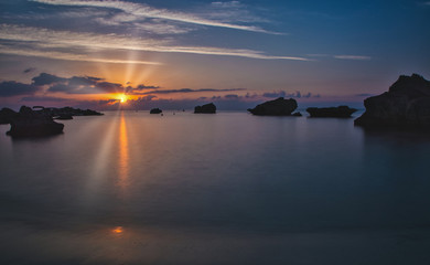 Fototapeta na wymiar Cyprus beach sunrise with wisps of clouds