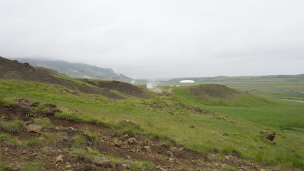 Fototapeta na wymiar Landschaft mit heißen Quellen und Wasserfällen im Hengill Geothermalgebiet / Süd-West-Island 