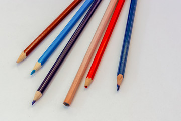 Fototapeta premium close-up old colored pencils on white background