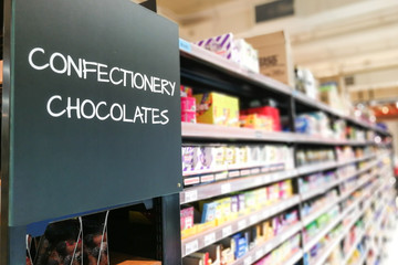 Confectionery, chocolate grocery categoy aisle at supermarket