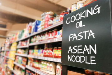 Cooking oil, pasta, noodle grocery categoy aisle at supermarket