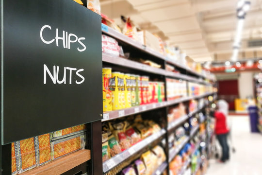 chips and Nuts grocery categoy aisle at supermarket